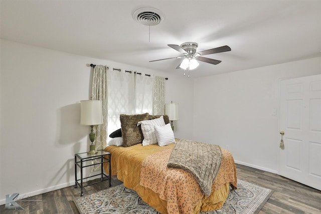 bedroom featuring dark hardwood / wood-style floors and ceiling fan