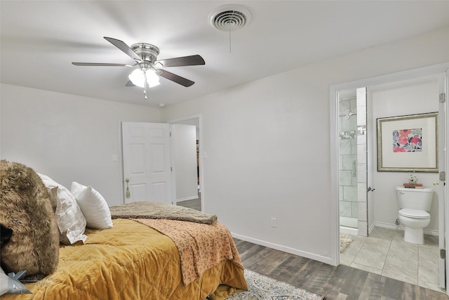 bedroom with light hardwood / wood-style flooring, ensuite bath, and ceiling fan