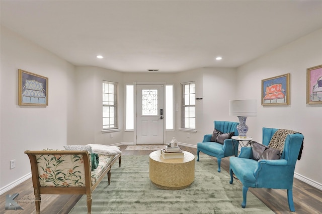 living area with hardwood / wood-style floors