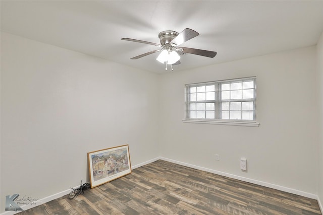 spare room featuring ceiling fan and dark hardwood / wood-style flooring