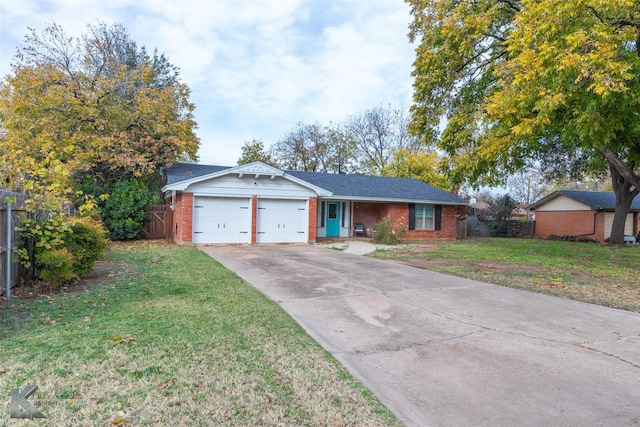 ranch-style house featuring a garage and a front yard