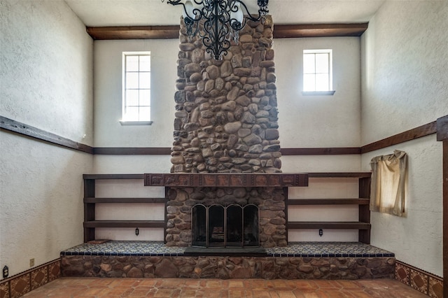 unfurnished living room with a fireplace and a healthy amount of sunlight