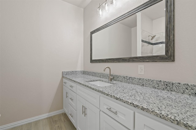 bathroom with vanity and wood-type flooring