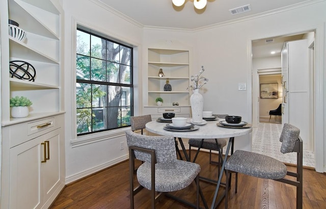 dining space with ornamental molding and dark wood-type flooring