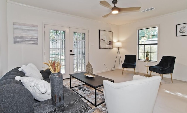 living room with french doors, ceiling fan, and ornamental molding