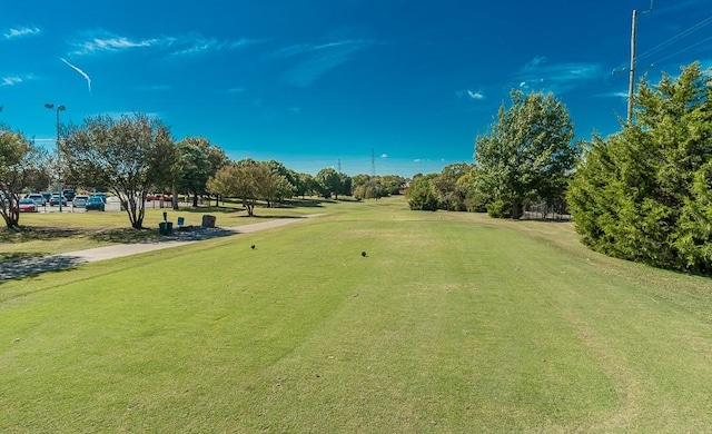 surrounding community featuring a yard