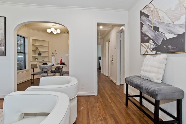 interior space featuring dark wood-type flooring and ornamental molding