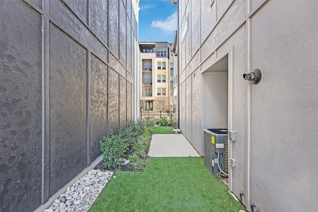 view of yard featuring central air condition unit