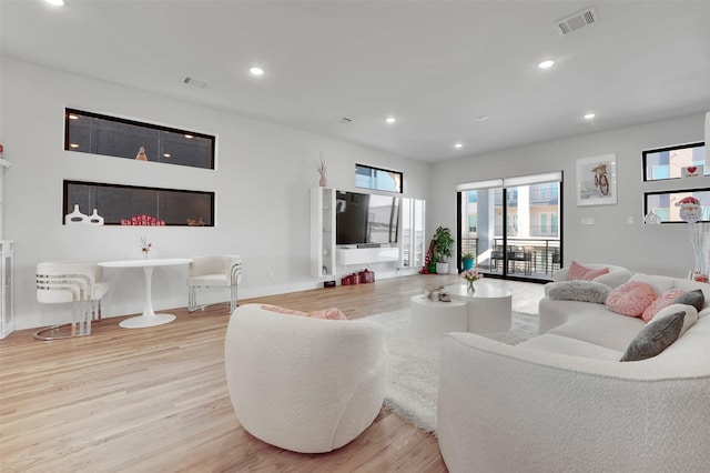 living room with light hardwood / wood-style flooring