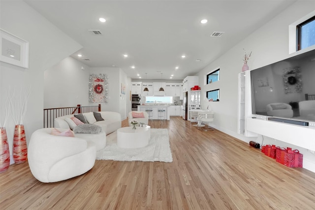 living room with light hardwood / wood-style floors