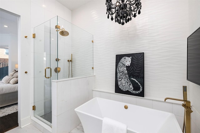 bathroom featuring separate shower and tub