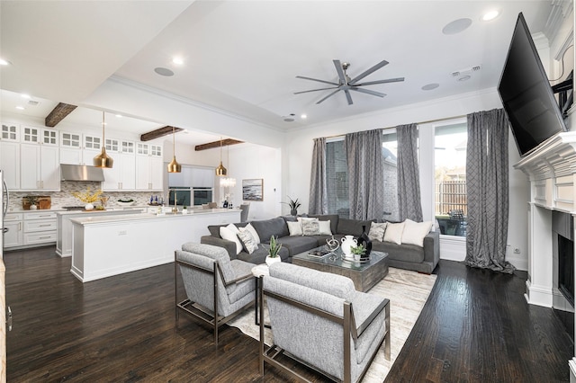 living room with beam ceiling, dark hardwood / wood-style floors, and ceiling fan