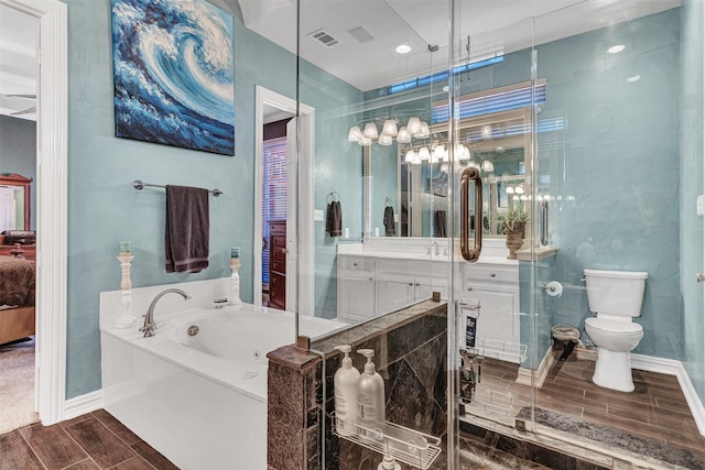 full bathroom with vanity, toilet, and separate shower and tub