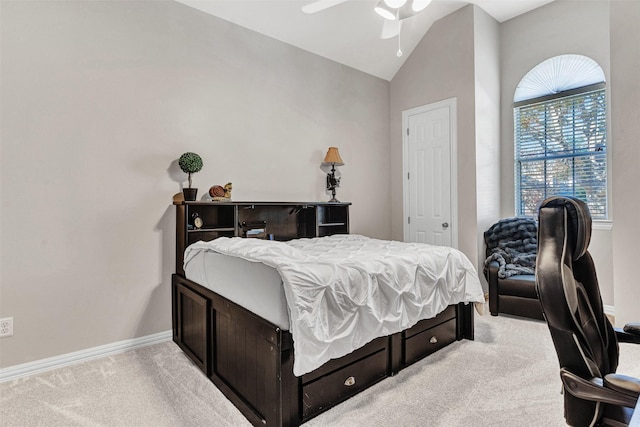 bedroom featuring ceiling fan, lofted ceiling, and light carpet