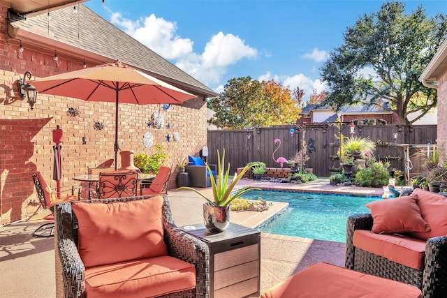 view of pool featuring a patio