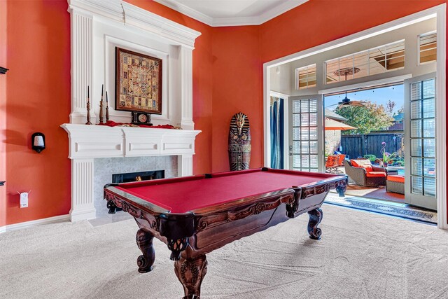 recreation room with light carpet, a fireplace, ornamental molding, and pool table