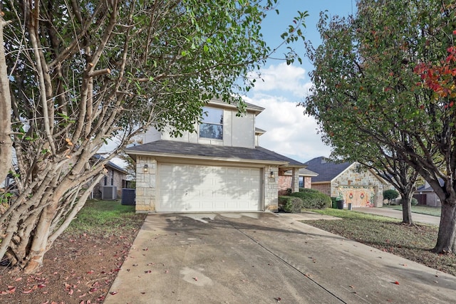 view of property with a garage and cooling unit