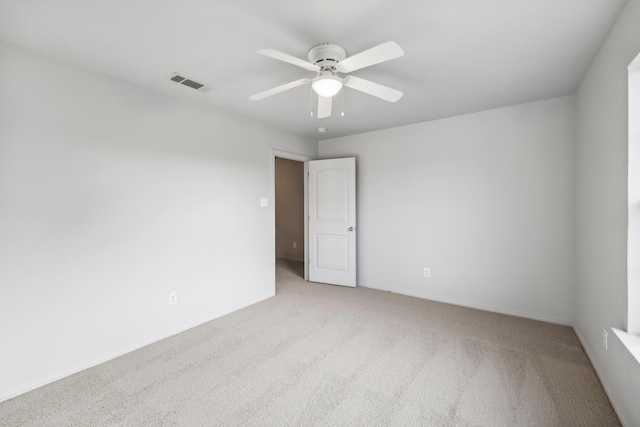 empty room with light carpet and ceiling fan