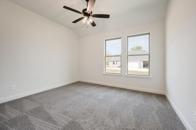 spare room with carpet flooring, ceiling fan, and lofted ceiling