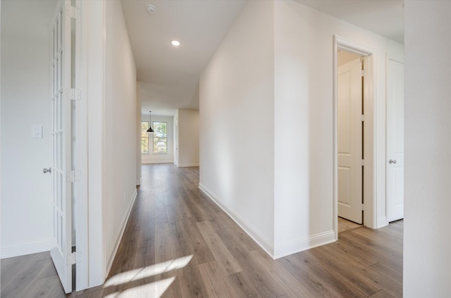 corridor featuring light hardwood / wood-style flooring