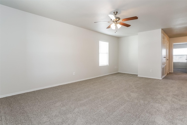 unfurnished room featuring ceiling fan and carpet floors