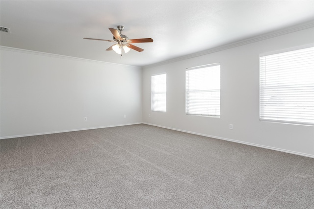 unfurnished room with ceiling fan, carpet floors, and ornamental molding