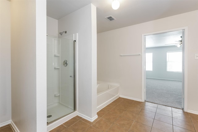 bathroom with tile patterned flooring, ceiling fan, and separate shower and tub