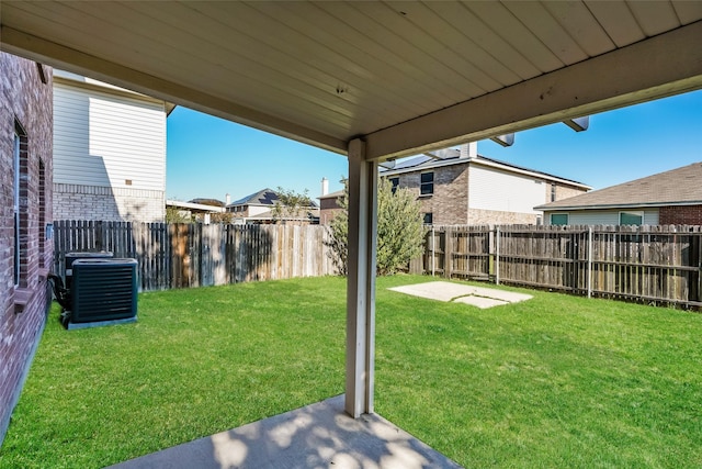 view of yard featuring a patio and central AC