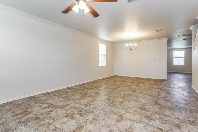 empty room featuring ceiling fan with notable chandelier and crown molding