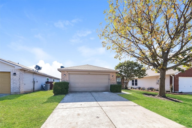 ranch-style house featuring a garage, central AC unit, and a front lawn