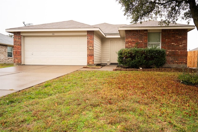 ranch-style home featuring a garage and a front yard