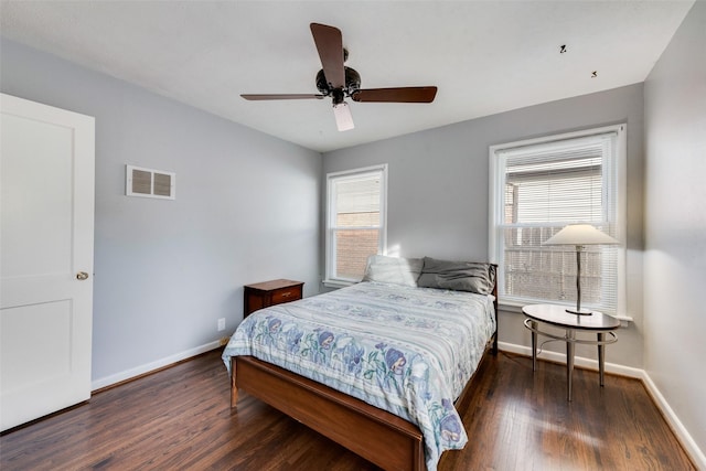 bedroom featuring dark hardwood / wood-style floors and ceiling fan