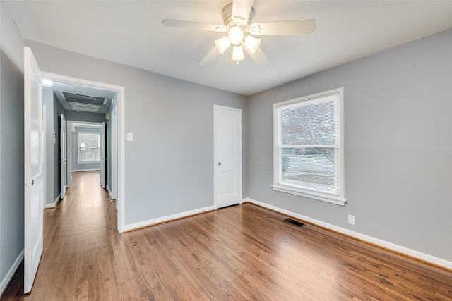 spare room with ceiling fan and hardwood / wood-style floors