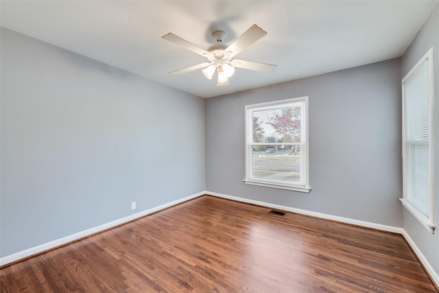 unfurnished room with ceiling fan and wood-type flooring