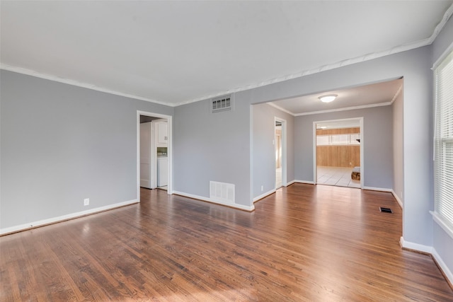 unfurnished room with crown molding and hardwood / wood-style floors