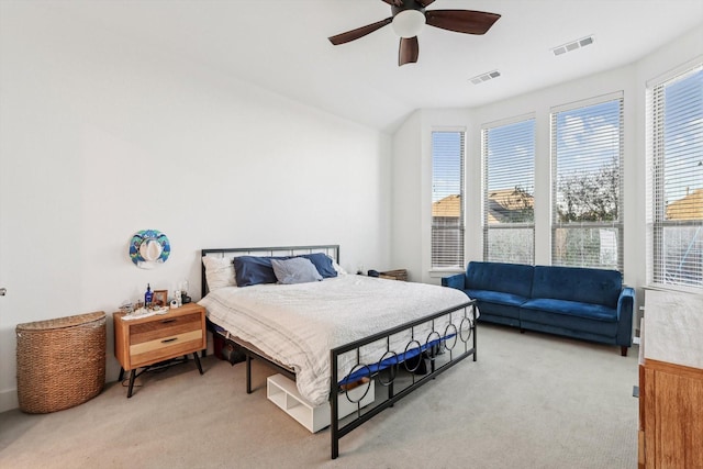 bedroom featuring ceiling fan and light carpet