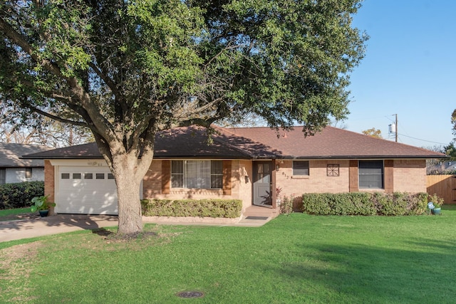 ranch-style home featuring a front lawn and a garage