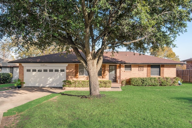 ranch-style home featuring a garage and a front yard