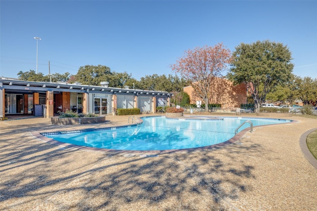 view of swimming pool featuring a patio