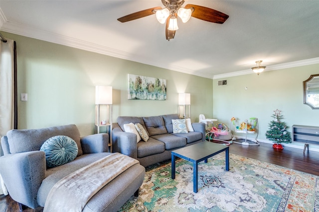 living room with dark hardwood / wood-style floors, ceiling fan, and crown molding