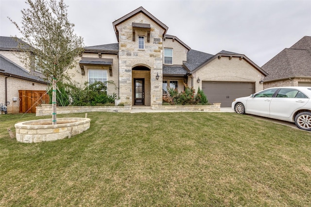 view of front of property featuring a garage and a front yard