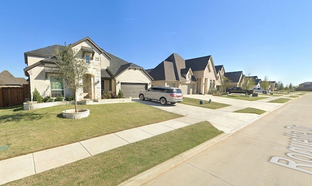 french provincial home with a front lawn and a garage