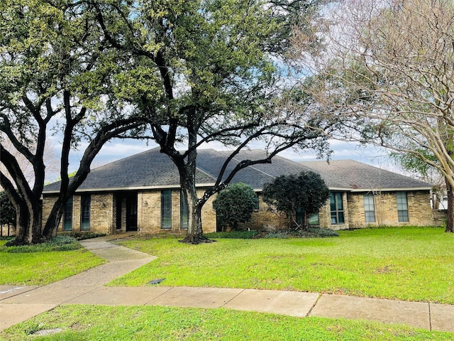 ranch-style house with a front lawn