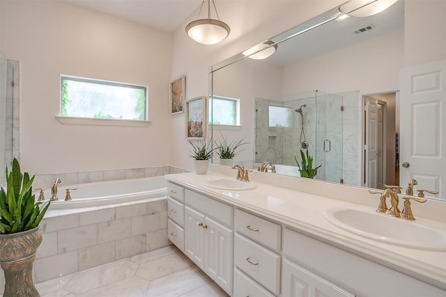 bathroom with vanity, a wealth of natural light, and shower with separate bathtub