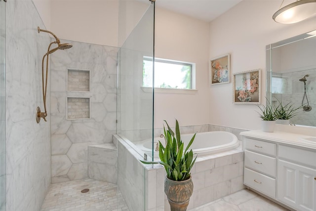 bathroom featuring independent shower and bath and vanity