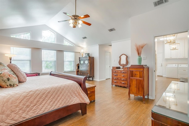 bedroom featuring ceiling fan, high vaulted ceiling, independent washer and dryer, and light hardwood / wood-style floors