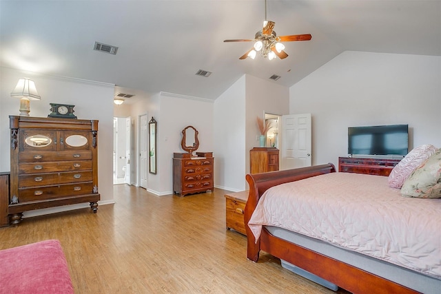 bedroom featuring light hardwood / wood-style flooring, ceiling fan, and vaulted ceiling