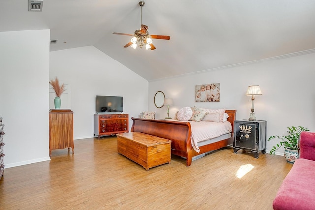 bedroom featuring ceiling fan, lofted ceiling, and light wood-type flooring