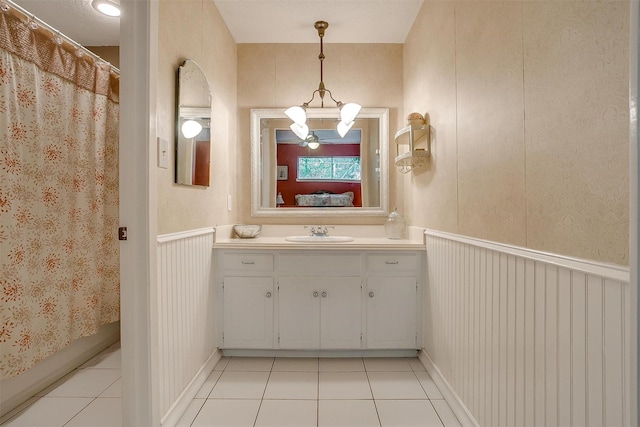 bathroom with tile patterned flooring and vanity