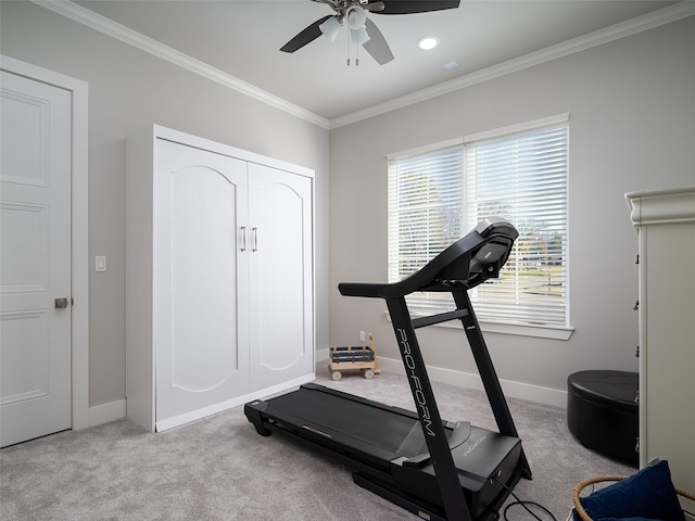 workout room with ceiling fan, light colored carpet, and crown molding